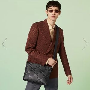 Gucci All Black leather GG embossed messenger bag